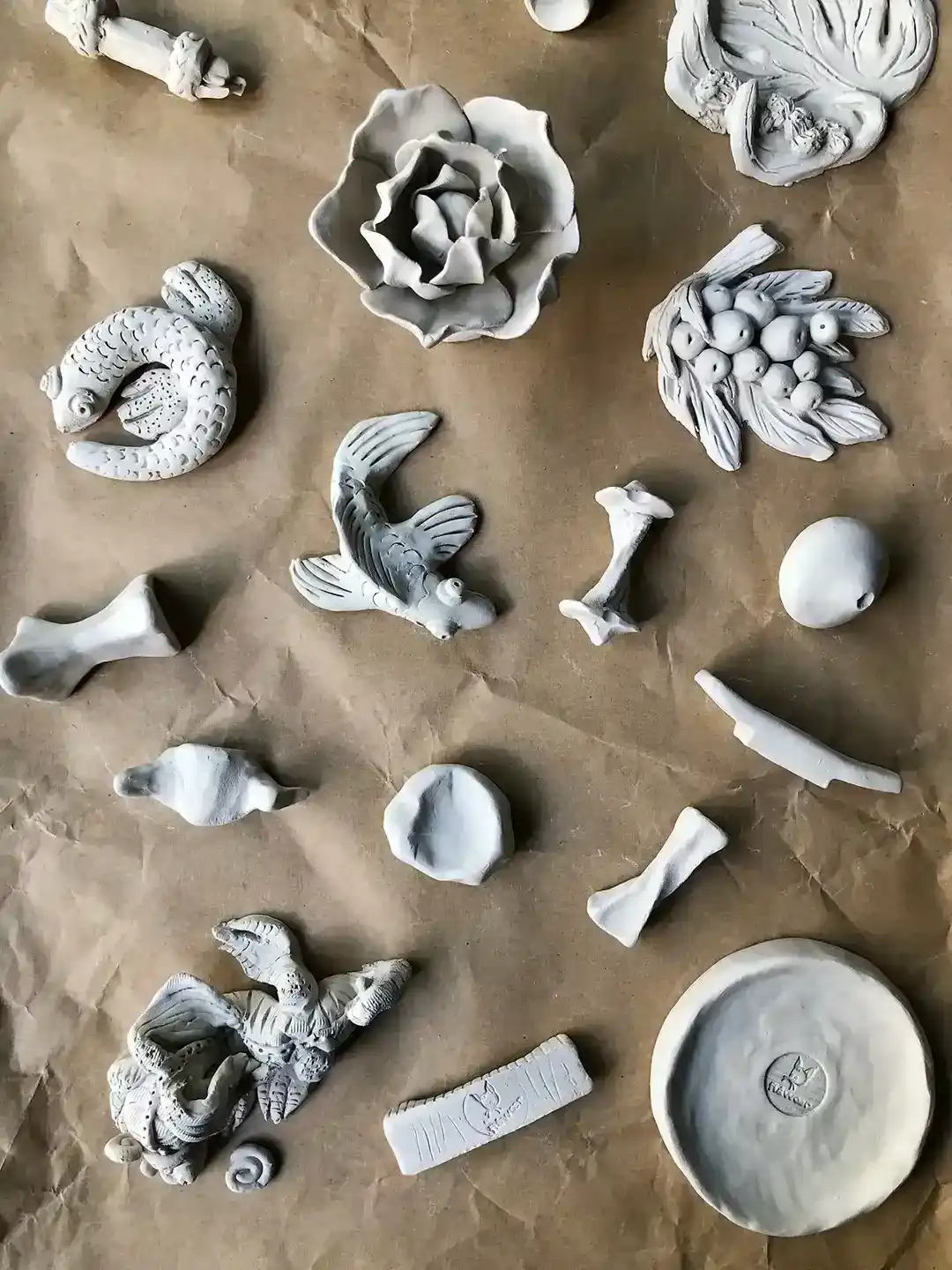 top view of handmade crafts made during the clay sculpting and wheel throwing pottery workshop