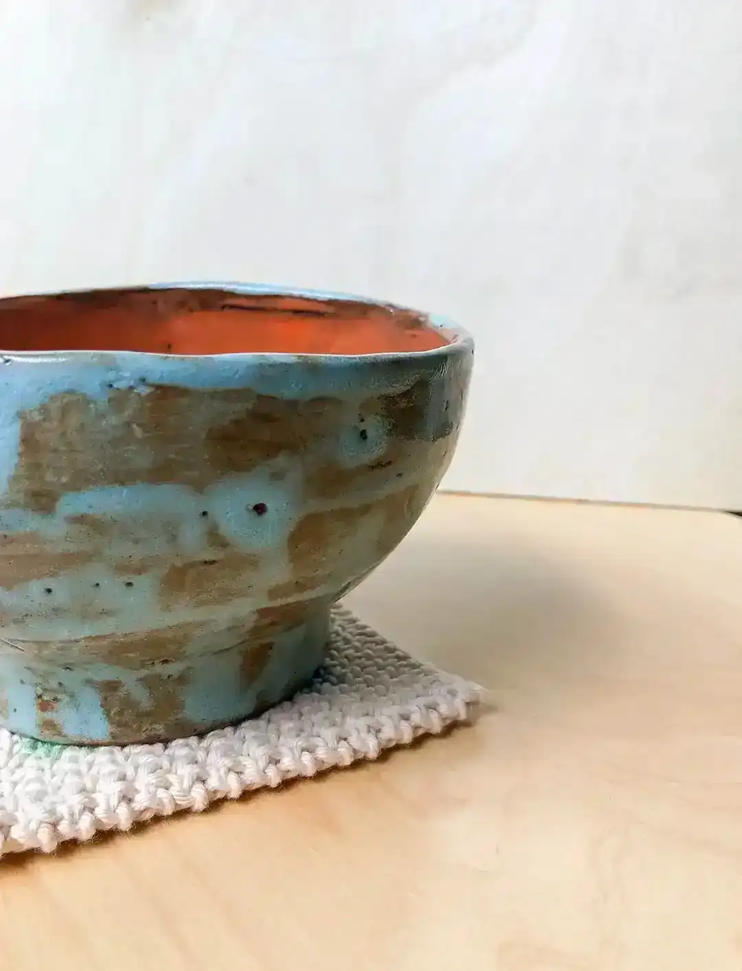handmade ceramic turquoise orange bowl glazed with pouring technique inside and with brush painting outside