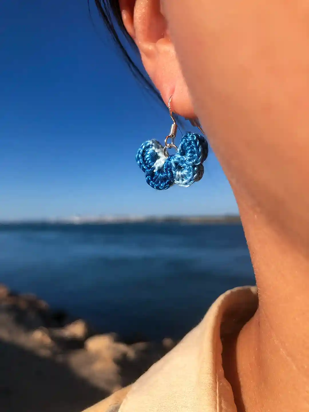 blue butterfly cotton mini crochet earrings from guadiana tiny friends 2024 collection