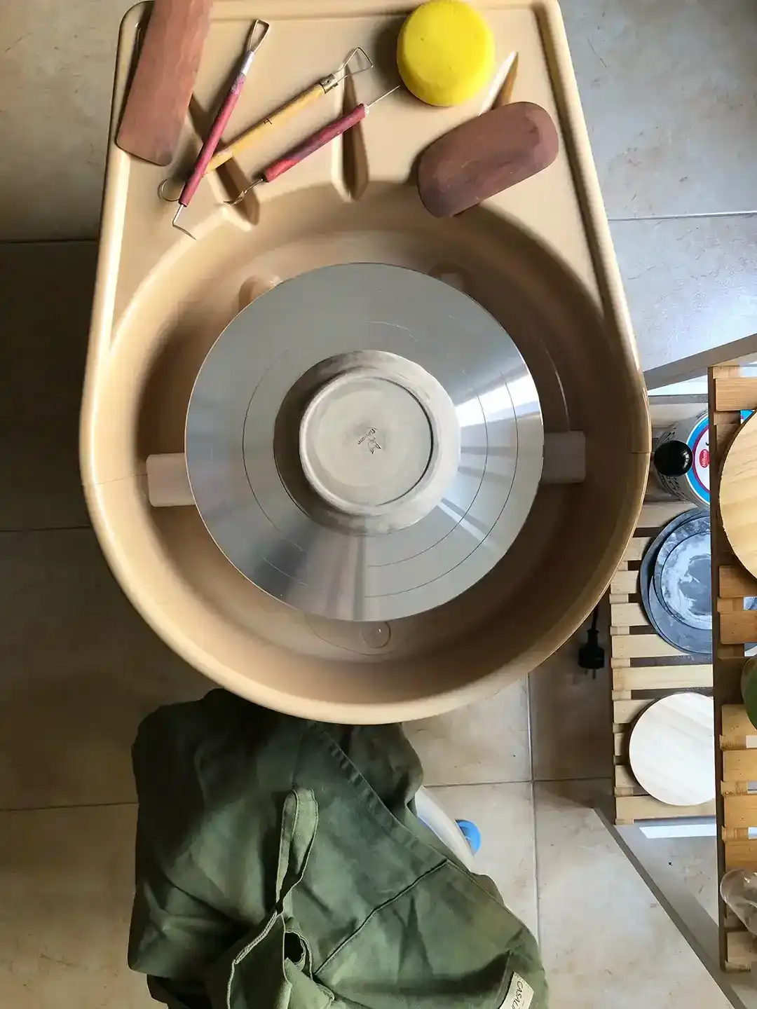 top view of pottery wheel and tools for ceramics class